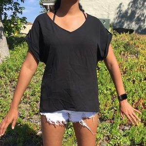 Sheer black blouse. It’s a low key v neck blouse.